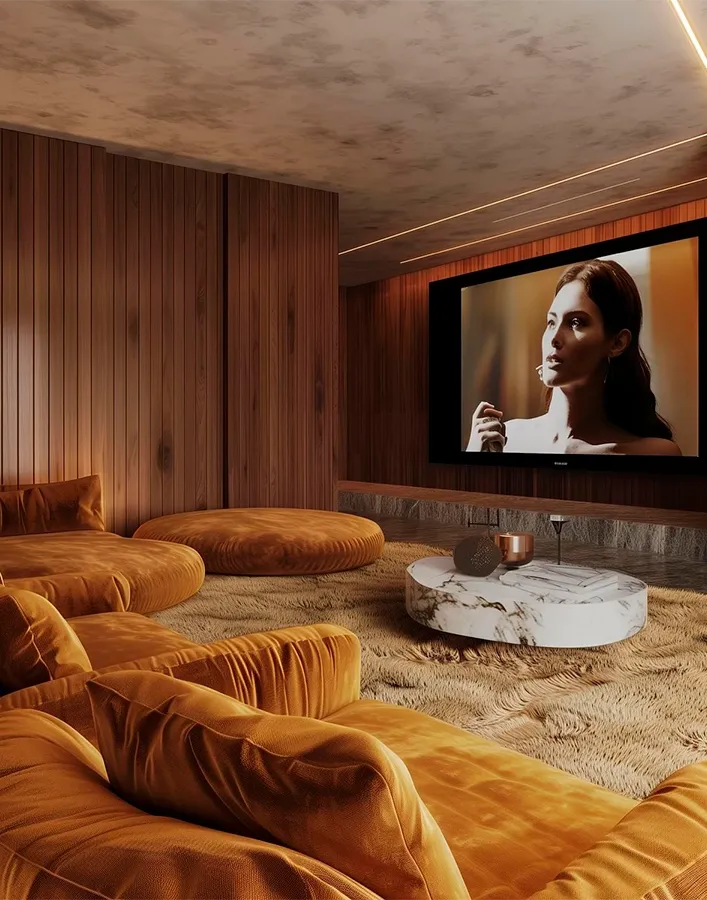 Warm-toned cinema entry with stone details and large display frame